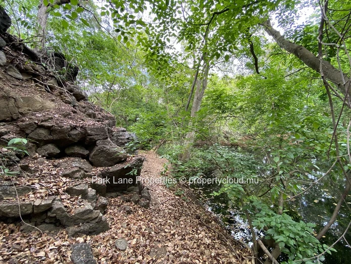 Serene Plot in Private Tamarin Estate with River Feature and Mountain Backdrop