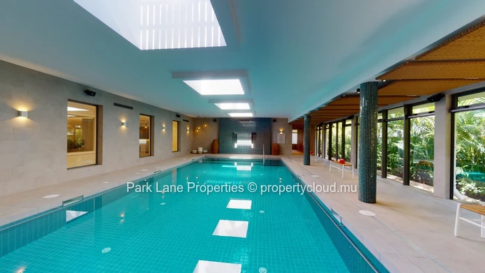 2-Bedroom Ground-Floor Apartment – Refined Island Living with Private Garden and Pool
