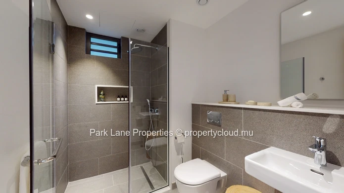 2-Bedroom Ground-Floor Apartment – Refined Island Living with Private Garden and Pool